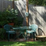 A fresh tree stump in a residential yard